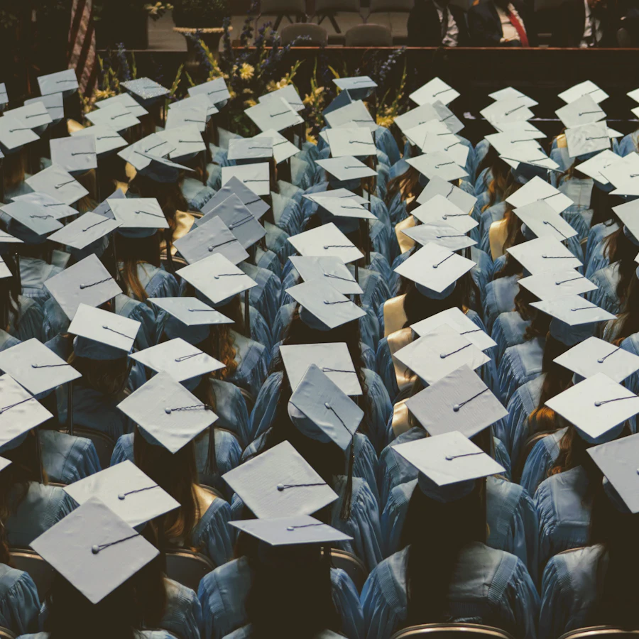 Rows of graduation caps at a ceremony