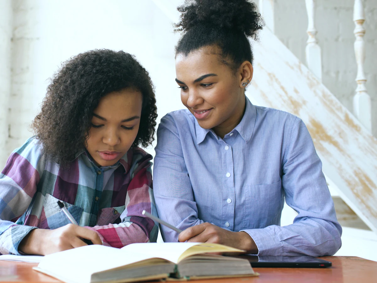 Two learners studying together at a table